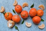 Tangerine with tangerine slices on a white background