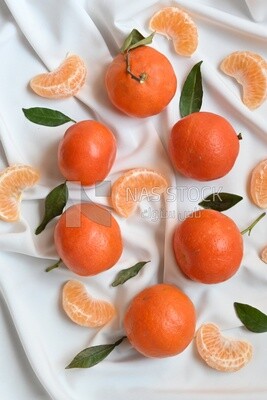 Tangerine with tangerine slices on a white background