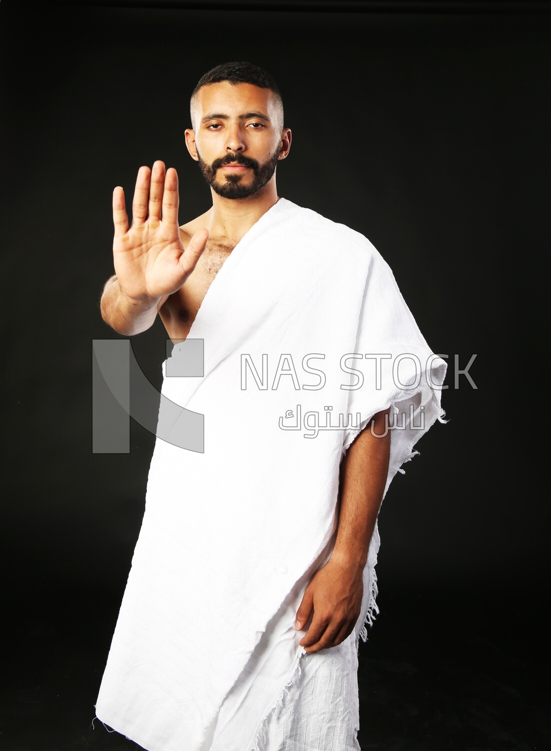 A man wearing an ihram dress