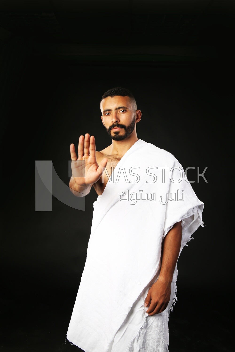 A man wearing an ihram dress