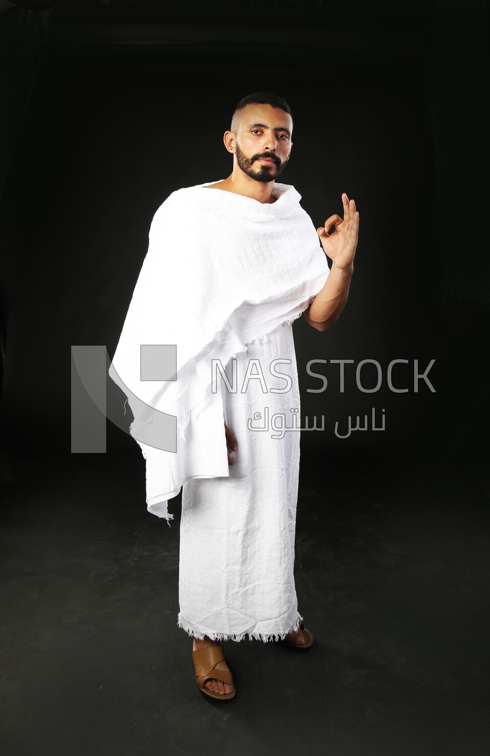 A man wearing an ihram dress