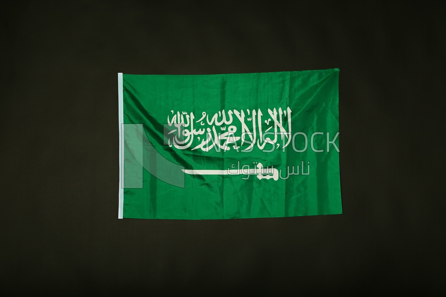 A flag of saudi arabia on a black background