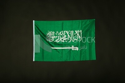 A flag of saudi arabia on a black background