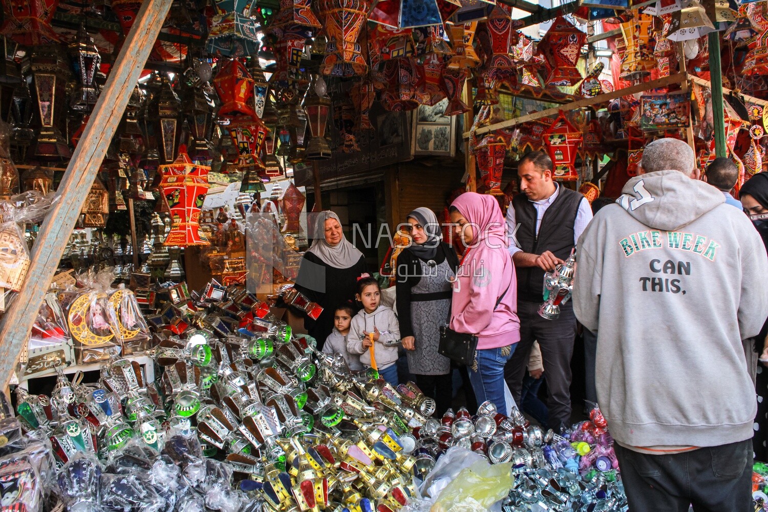 group of Egyptians buy lanterns and Ramadan decorations to celebrate Ramadan