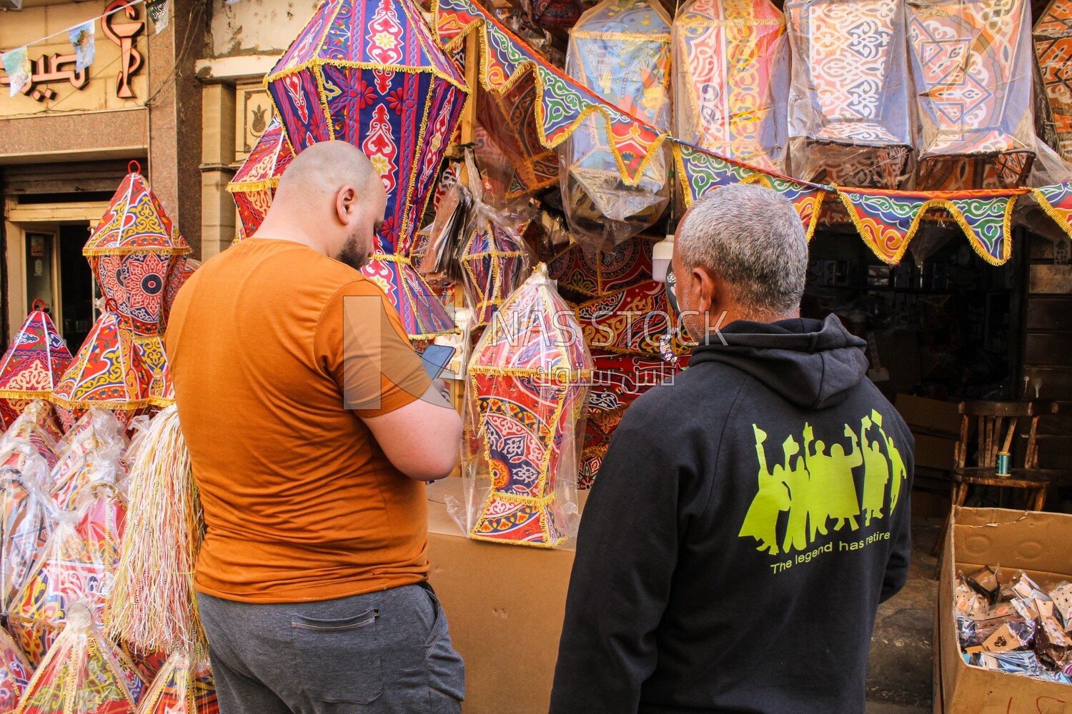 Two men buy lanterns in Cairo, Egypt