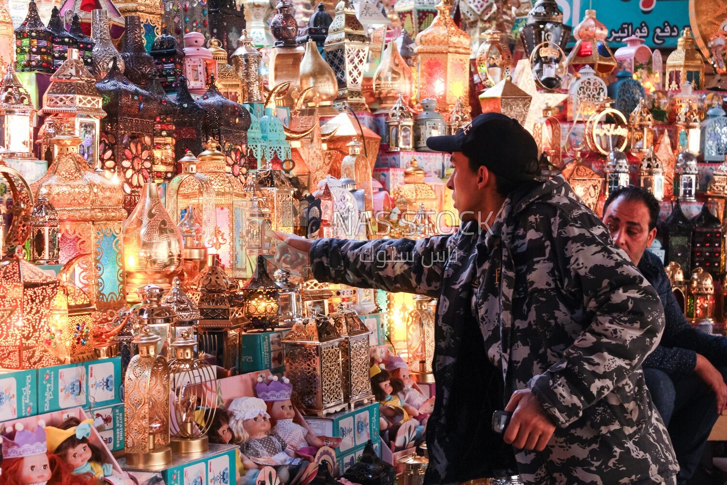 man buys a lantern to celebrate Ramadan
