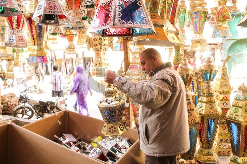 man buys a lantern to celebrate Ramadan