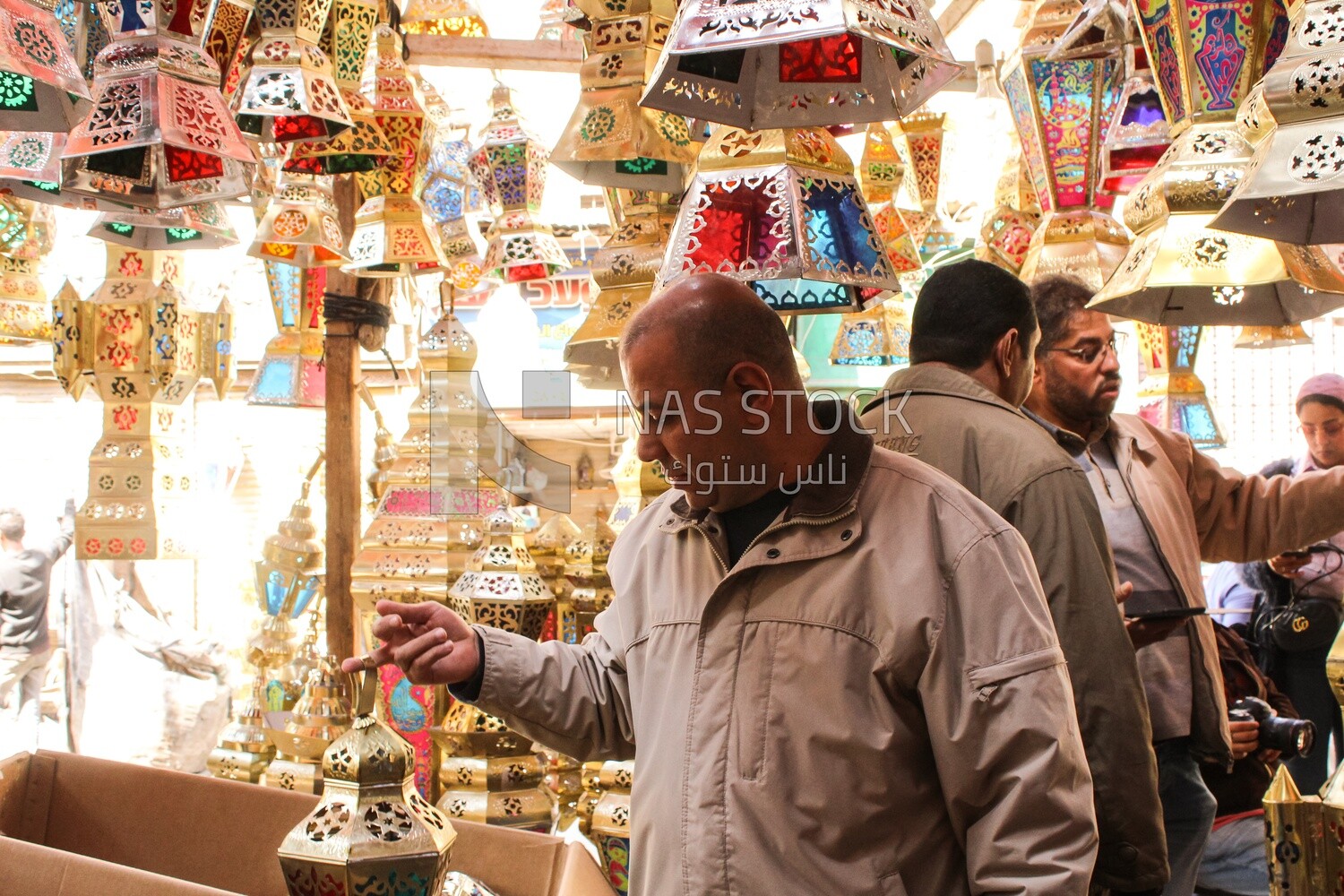 man buys a lantern to celebrate Ramadan