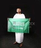 A man wearing an ihram dress prays