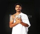 A man wearing an ihram dress prays