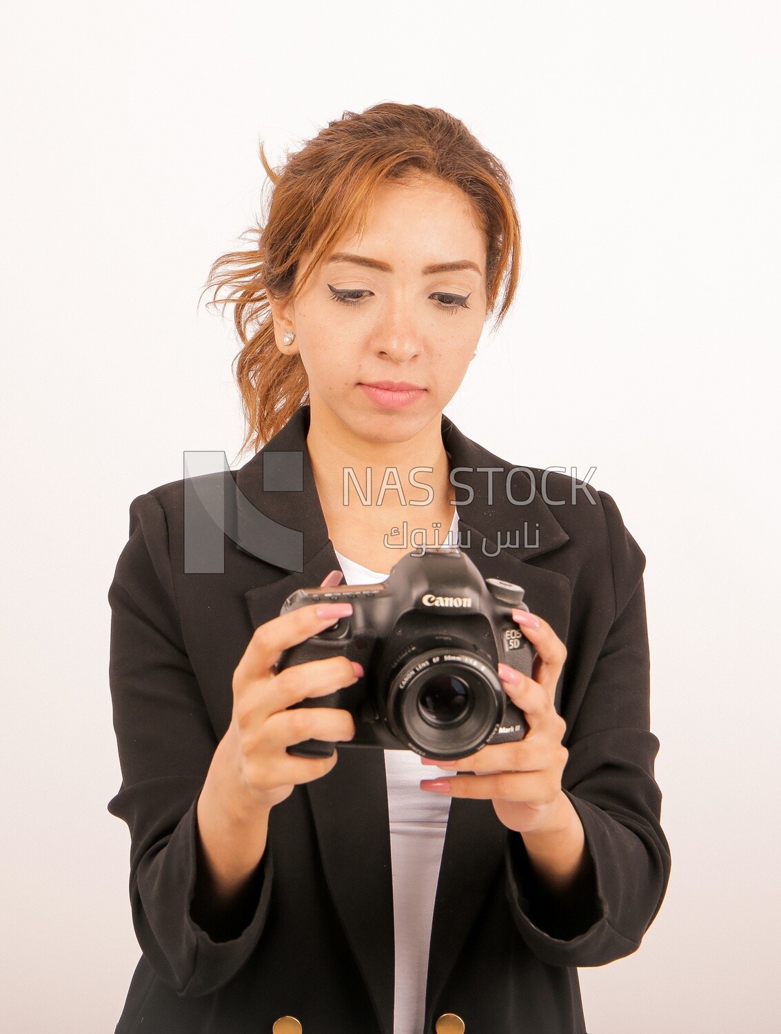 A woman holding a camera
