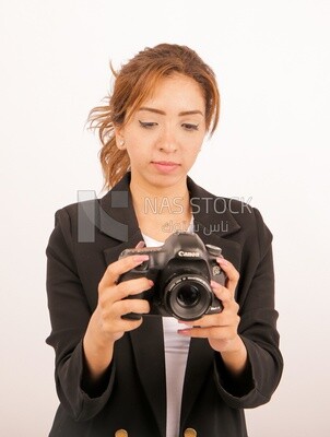 A woman holding a camera