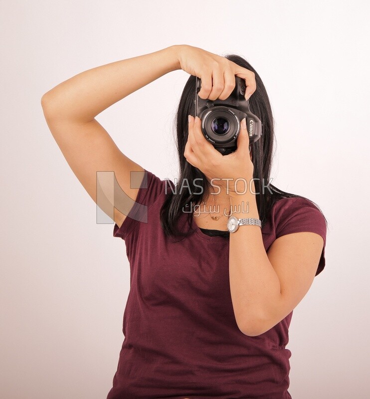 A woman holding a camera