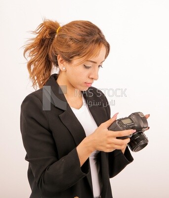 A woman holding a camera