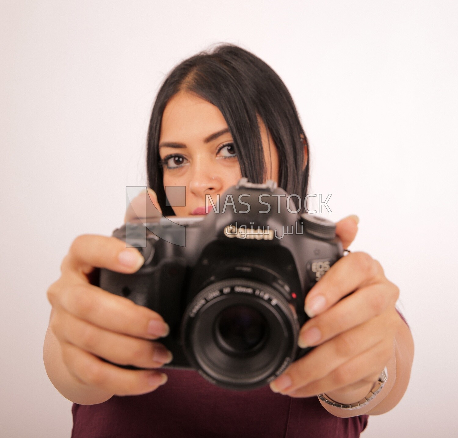 A woman holding a camera