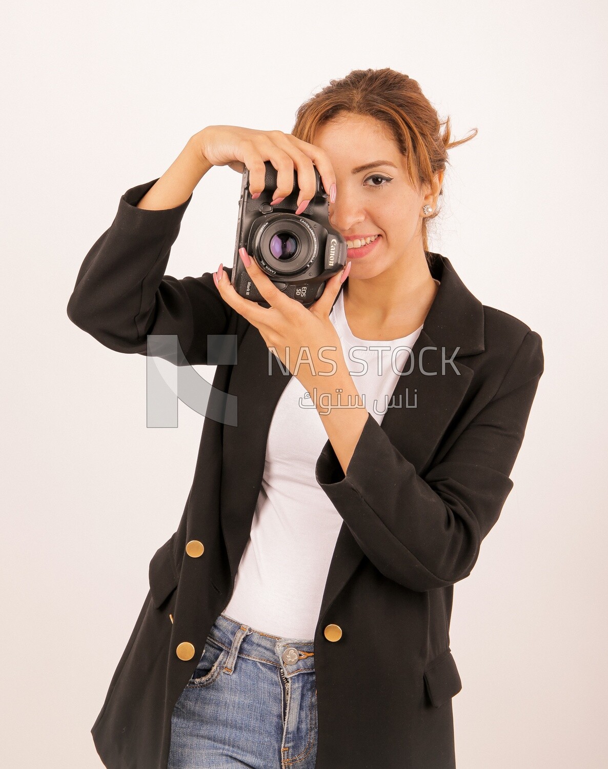 A woman holding a camera