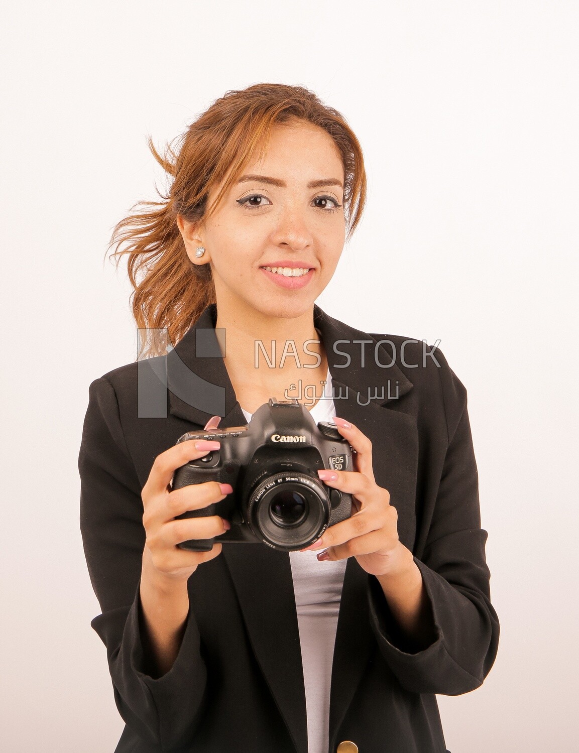 A woman holding a camera