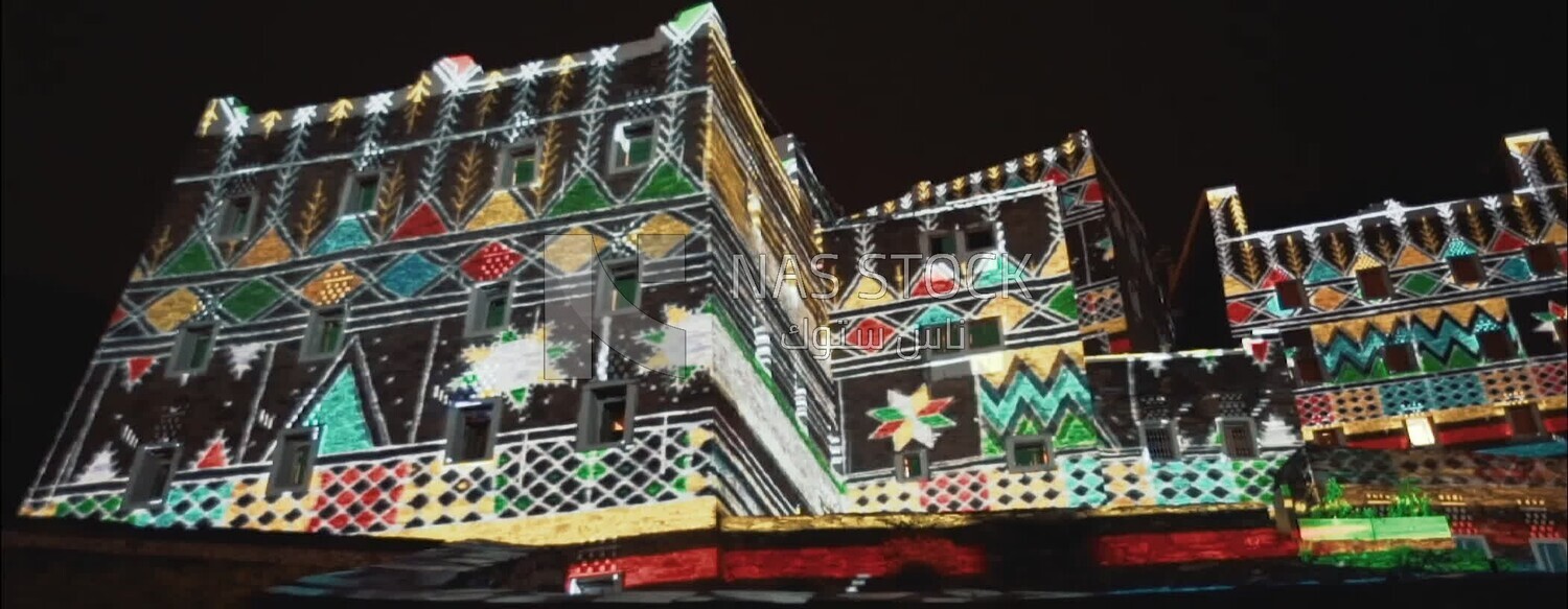 Celebration lights decorate the buildings of Rijal Almaa Village, Asir, Saudi Arabia