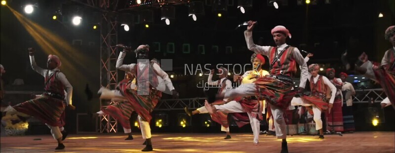 Group of men dancing and celebrating in Rijal Almaa village, Asir, Saudi Arabia