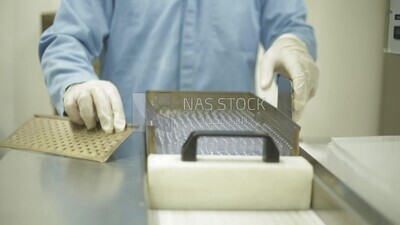 worker collects injection ampoules