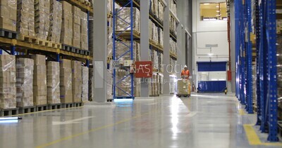 Workers ride pickup carts and load boxes