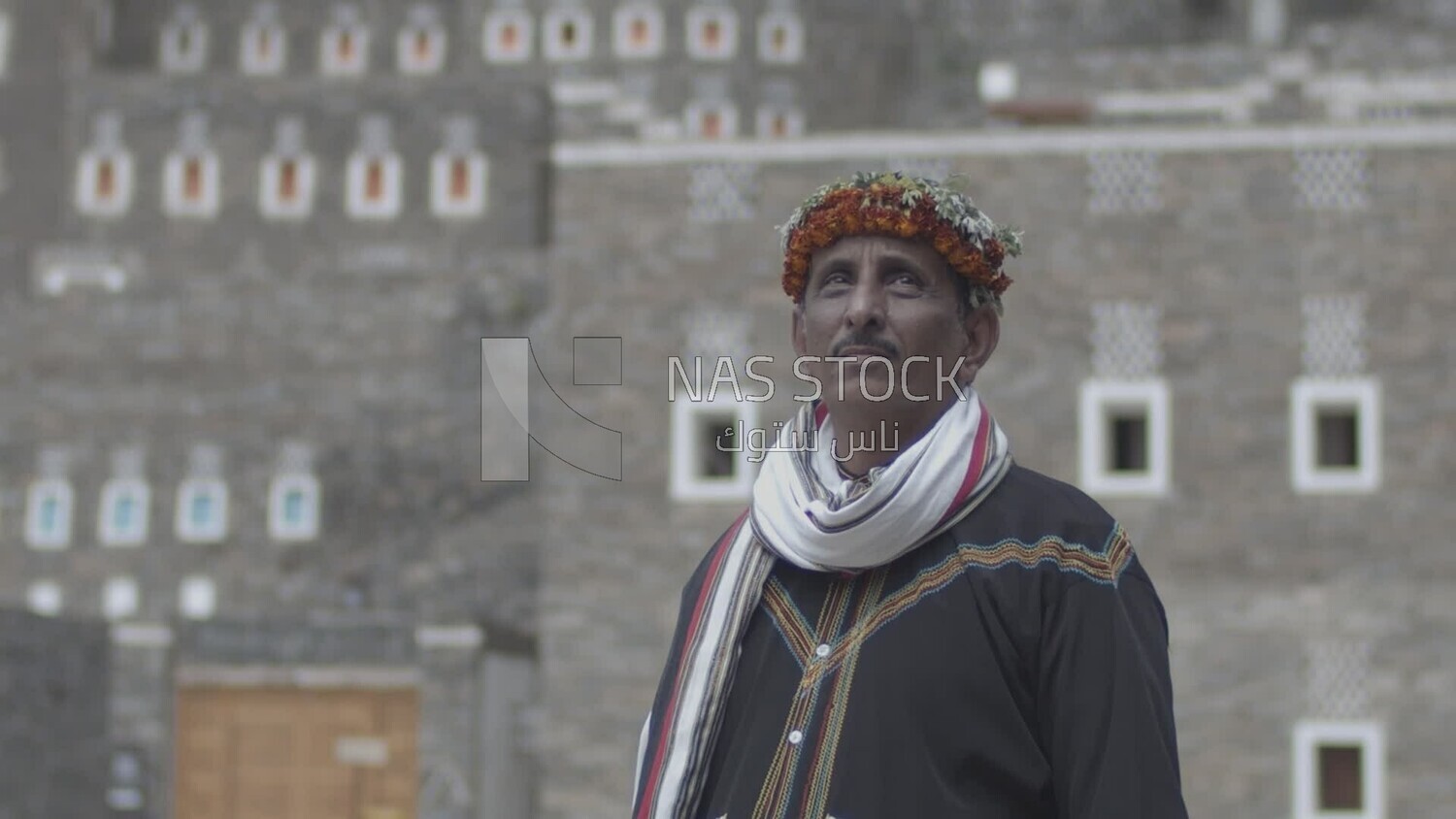 Saudi man wearing a wreath of Asiri roses, southern folk costume, Rijal Almaa village, Asir, Saudi Arabia