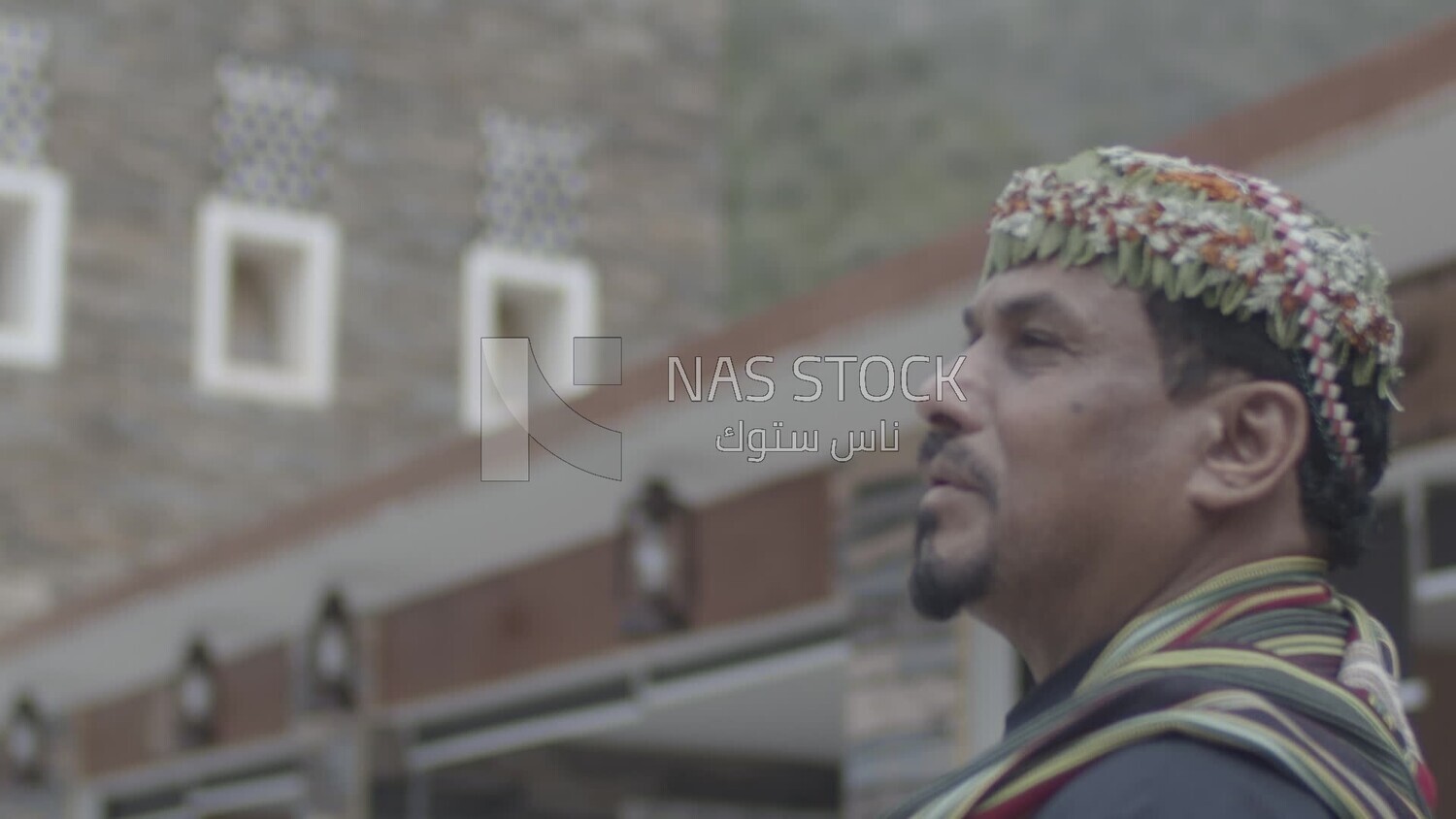 Saudi man wearing a wreath of Asiri roses, Rijal Almaa village, Asir, Saudi Arabia