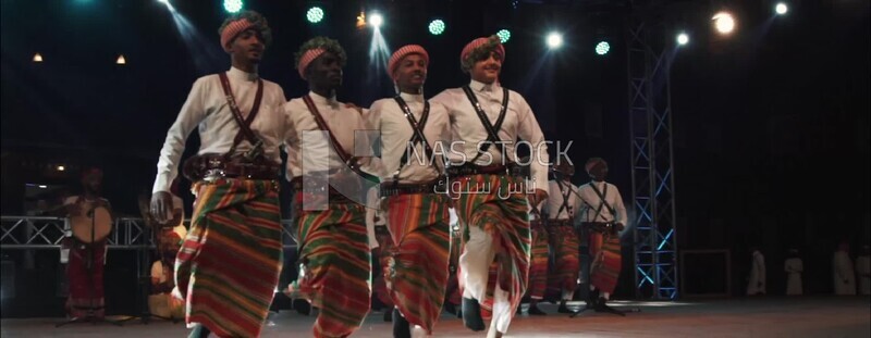 Group of men dancing and celebrating in Rijal Almaa village, Asir, Saudi Arabia