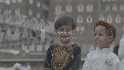 Two children in traditional clothes in the Asir region, Saudi Arabia