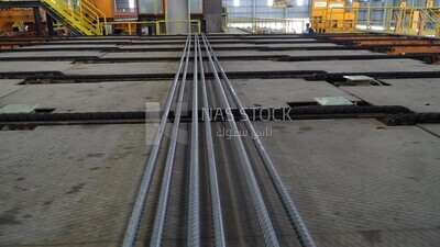 Concrete bars on the conveyor belt in the iron and steel factory