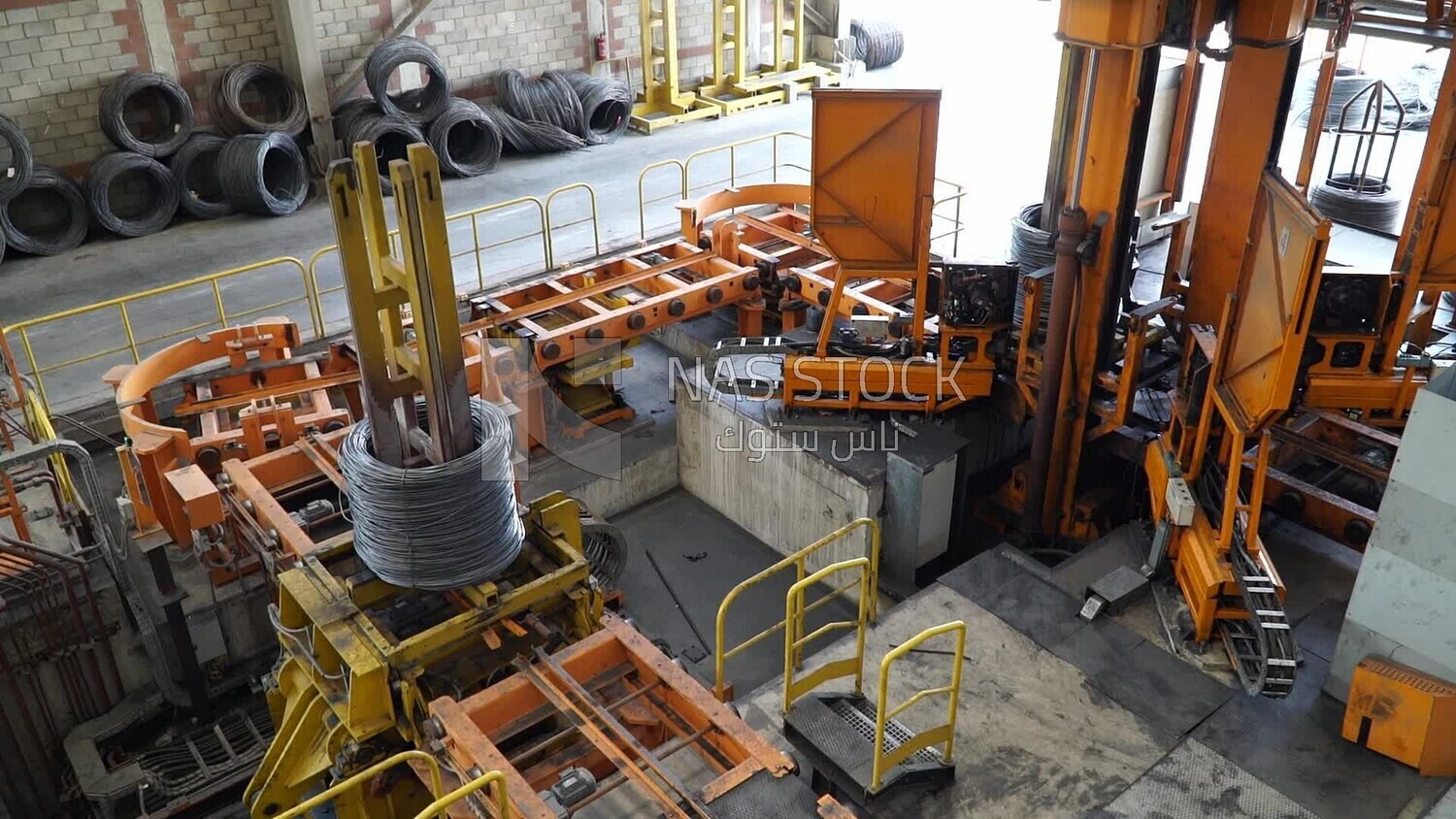 Group of rebar on a machine in a concrete factory