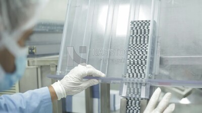 white tablets in the medicine packing machine