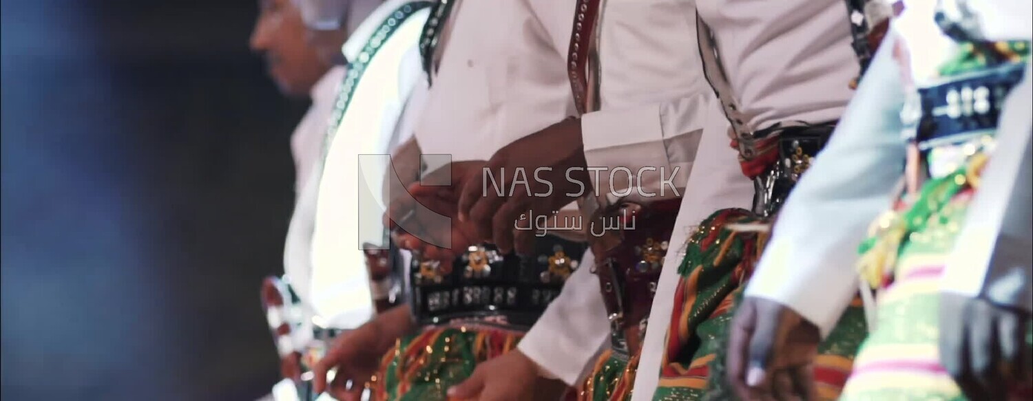 Group of men dancing and celebrating in Rijal Almaa village, Asir, Saudi Arabia