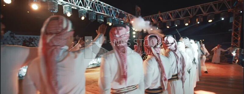 a group of men dancing in aseer province