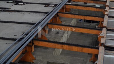 Concrete bars on the conveyor belt in the iron and steel factory