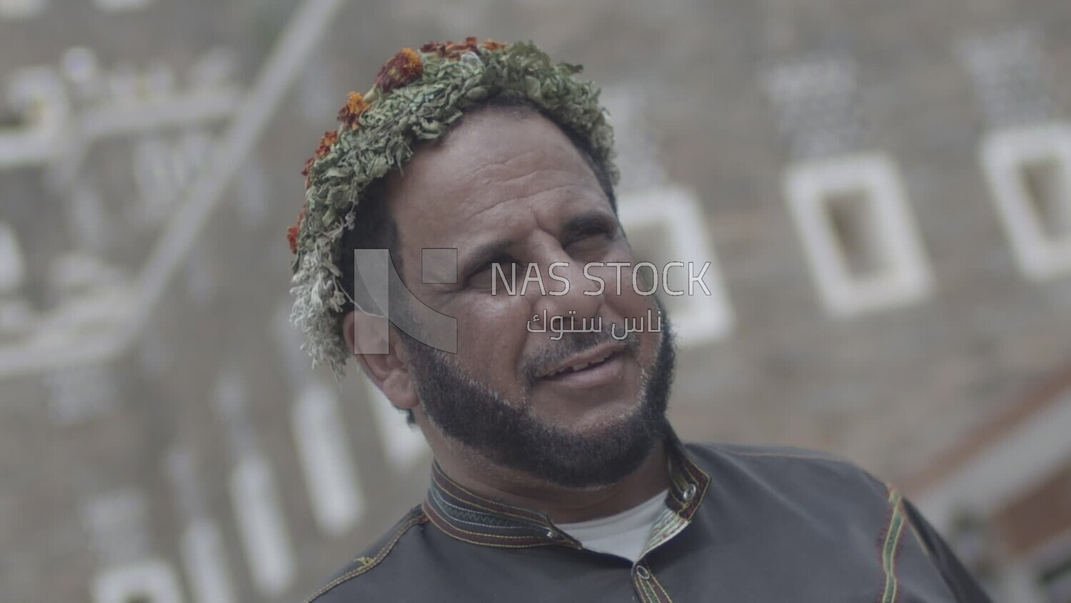 Saudi man wearing a wreath of Asiri roses, southern folk costume, Rijal Almaa village, Asir, Saudi Arabia