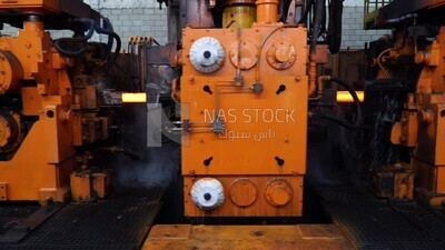 Molten and glowing iron in a metal production factory