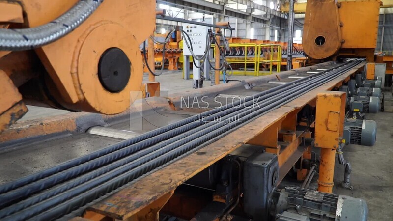 Concrete bars on the conveyor belt in the iron and steel factory