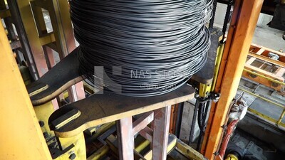 Group of rebar on a machine in a concrete factory