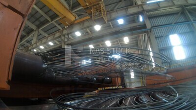 Rings of reinforcing steel on the conveyor belt in the iron and steel factory