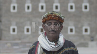 Saudi man wearing a wreath of Asir roses, Rijal Almaa village, Asir, Saudi Arabia