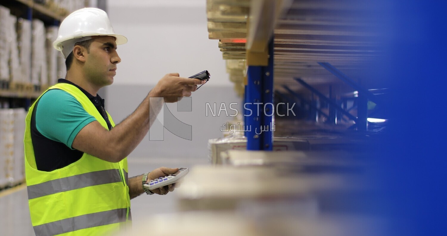 Man scanning a code from the box in the store