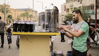 street vendor selling Ramadan juices &quot;Tamarind Indian&quot; in Cairo, Egypt,