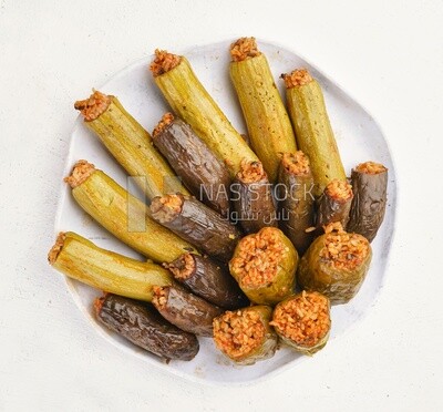 Top view of a dish made of stuffed zucchini, stuffed peppers and stuffed eggplant