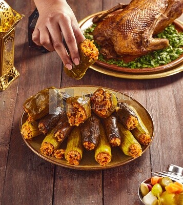 Side view of a scene from a person eating stuffed peppers from the Ramadan table