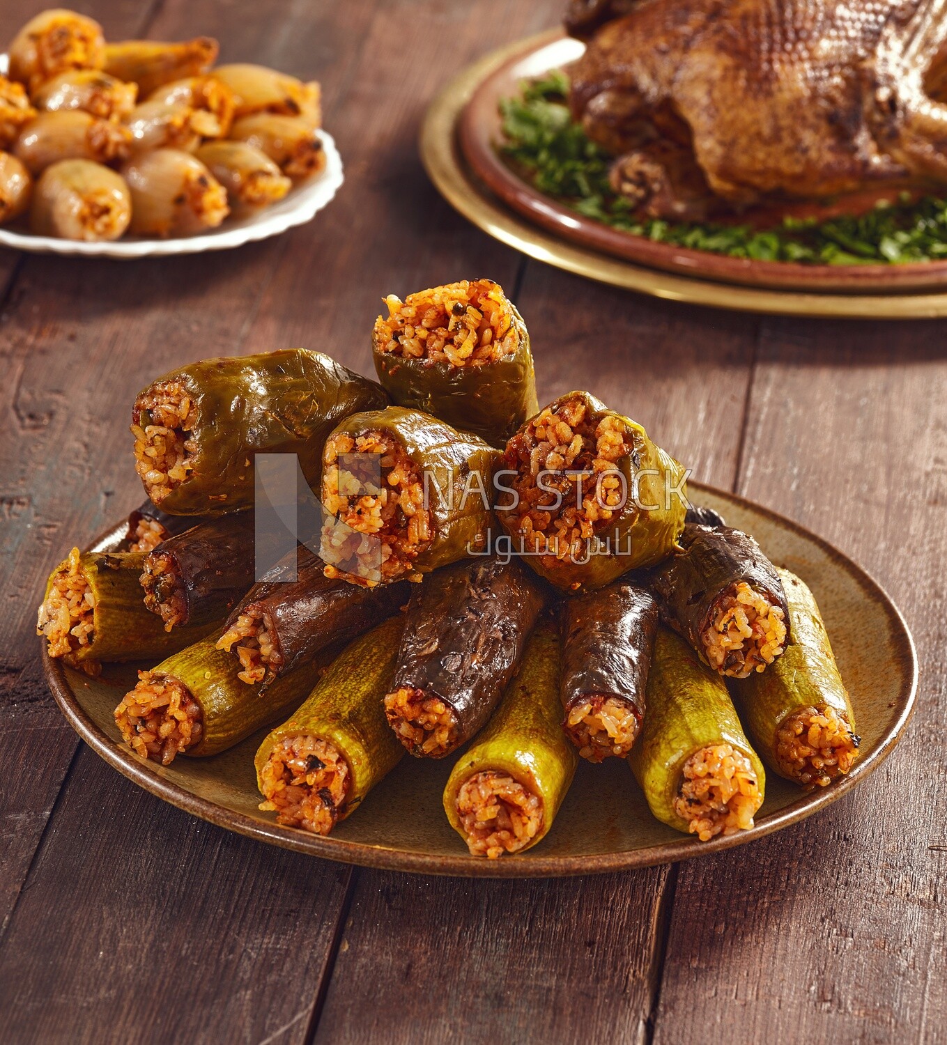 Side view of a scene from a dish made of stuffed zucchini, stuffed peppers and stuffed eggplant