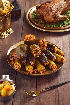 Side view of a scene from a dish made of stuffed zucchini, stuffed peppers and stuffed eggplant