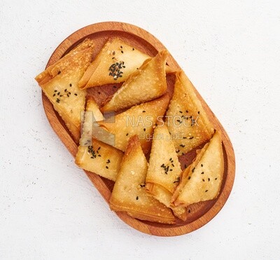 Top view of a plate of Samosa on a white background