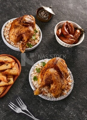 Side view of a dining table with chicken rice, samosa and mombar