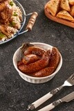 Side view of a dining table with a plate of stuffed mombar